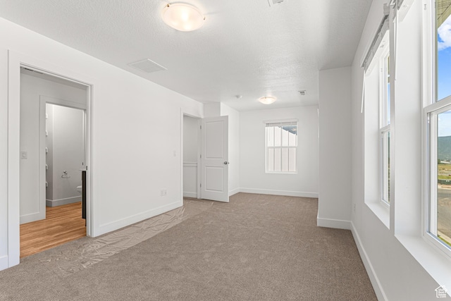1044 E 1930 S Unit 419, Heber City, UT 84032 - spare room with carpet floors and a textured ceiling