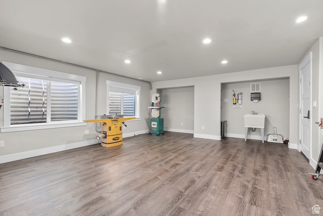 unfurnished living room with hardwood / wood-style flooring
