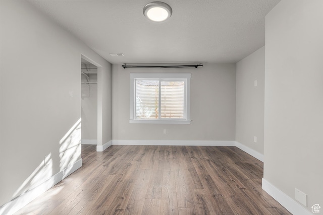 2388 E Horizon Dr Unit 907, Eagle Mountain, UT 84005 - empty room with wood finished floors and baseboards