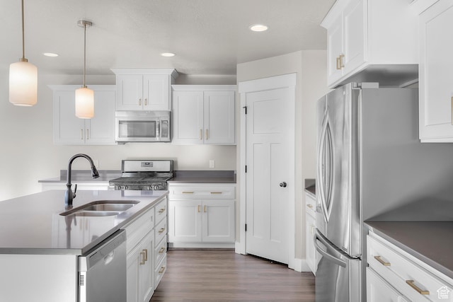 2388 E Horizon Dr Unit 907, Eagle Mountain, UT 84005 - kitchen with stainless steel appliances, a sink, white cabinetry, recessed lighting, and dark wood-style floors