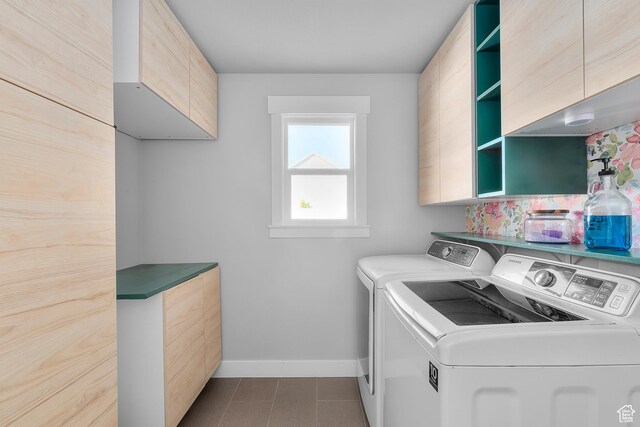 2388 E Horizon Dr Unit 907, Eagle Mountain, UT 84005 - laundry room with washing machine and clothes dryer, cabinet space, and baseboards