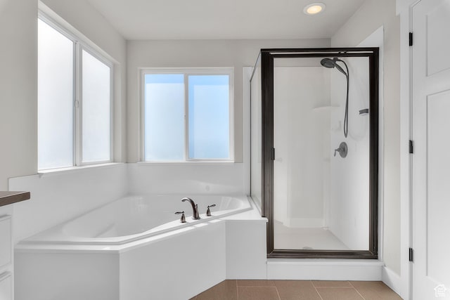 2388 E Horizon Dr Unit 907, Eagle Mountain, UT 84005 - bathroom featuring a shower stall, a garden tub, tile patterned flooring, and recessed lighting