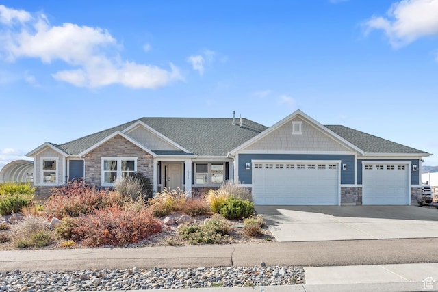 2388 E Horizon Dr Unit 907, Eagle Mountain, UT 84005 - craftsman-style home with stone siding, an attached garage, concrete driveway, and roof with shingles