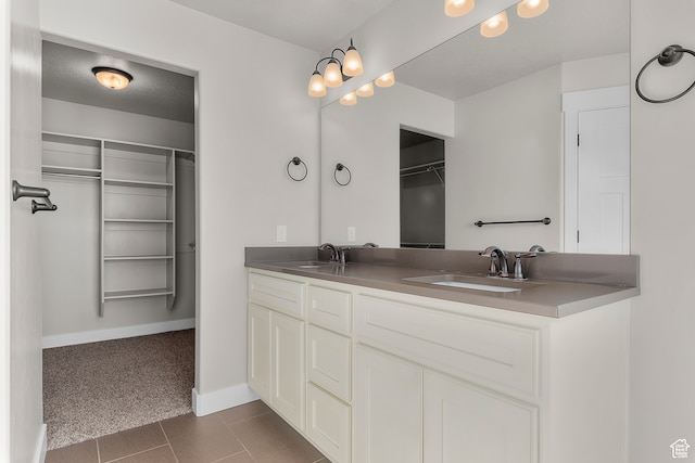 bathroom featuring tile patterned flooring and vanity