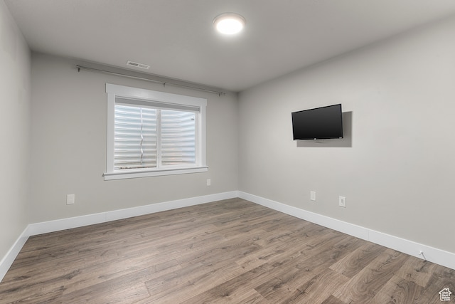 unfurnished room featuring light hardwood / wood-style flooring