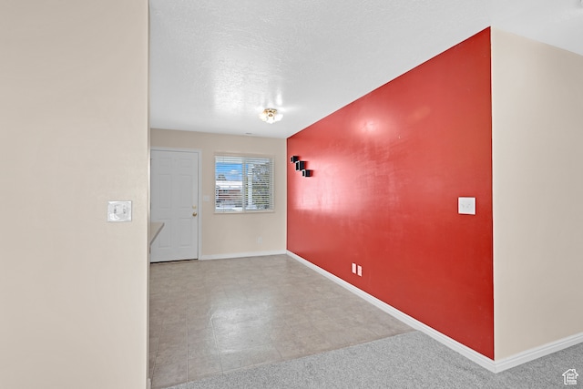 interior space featuring a textured ceiling