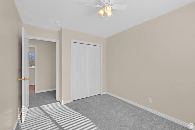 unfurnished bedroom with ceiling fan, light carpet, and a closet