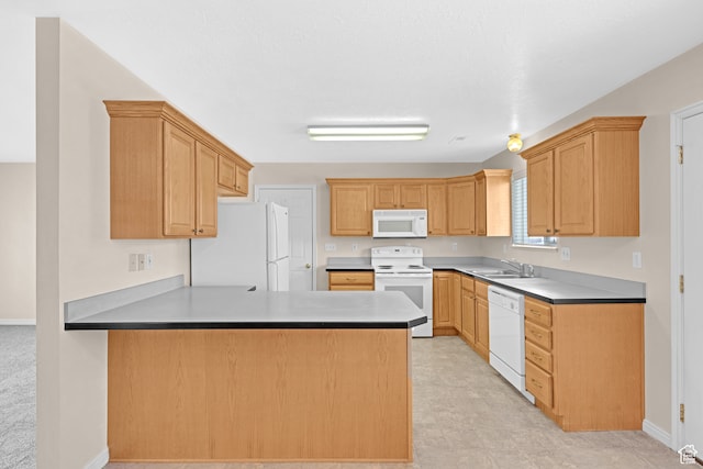 kitchen featuring kitchen peninsula, light brown cabinets, white appliances, and sink