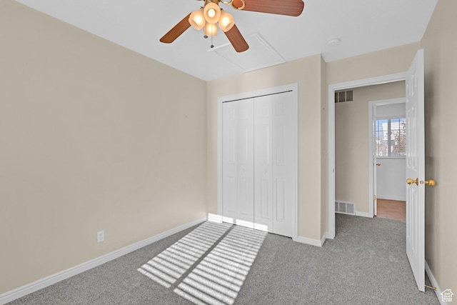 unfurnished bedroom featuring light carpet, a closet, and ceiling fan