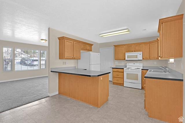 kitchen featuring white appliances, sink, a textured ceiling, light colored carpet, and kitchen peninsula