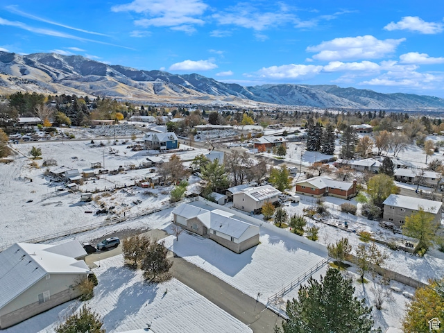 snowy aerial view with a mountain view