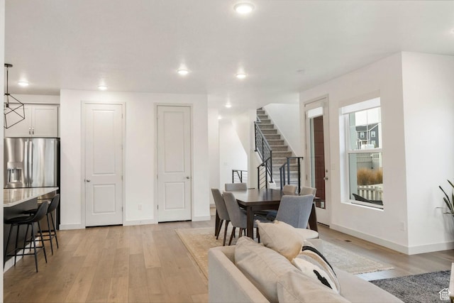 dining area featuring light wood-type flooring