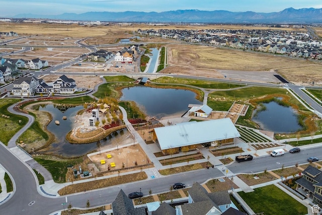 aerial view featuring a water and mountain view
