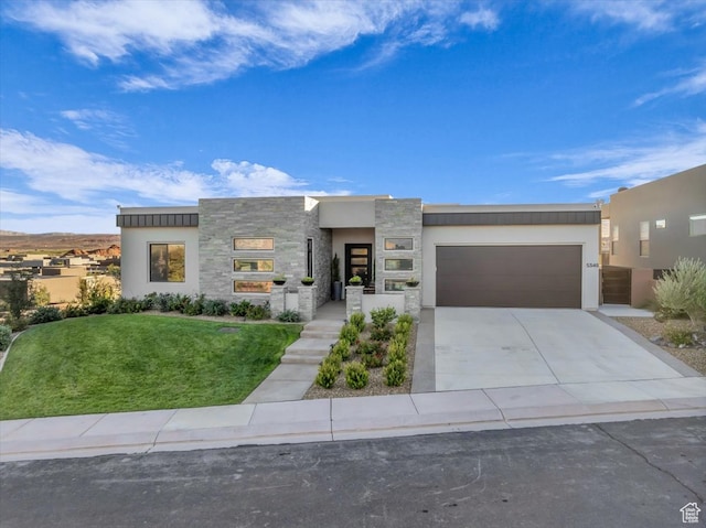 5349 W 3160 S, Hurricane, UT 84737 - contemporary home with a garage and a front lawn