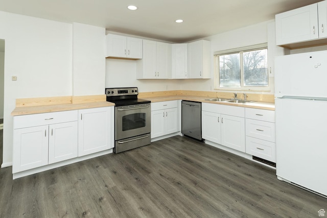 215 N 300 W, Salina, UT 84654 - kitchen featuring stainless steel appliances, wooden counters, dark wood finished floors, recessed lighting, and white cabinets