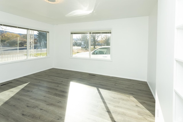215 N 300 W, Salina, UT 84654 - empty room with plenty of natural light and wood finished floors