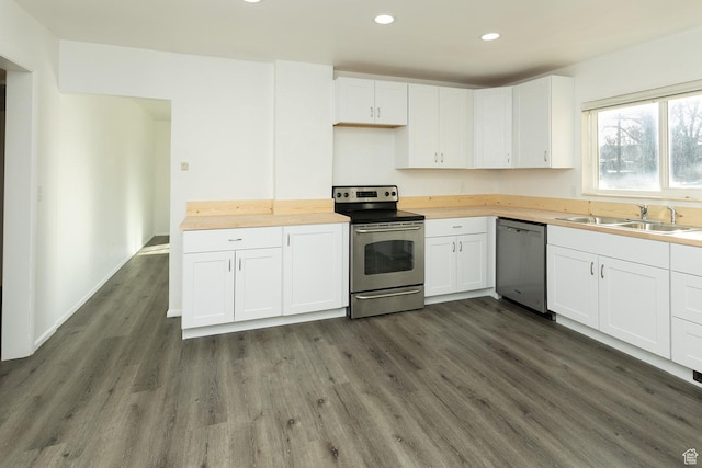 215 N 300 W, Salina, UT 84654 - kitchen with stainless steel appliances, butcher block counters, dark wood-type flooring, white cabinetry, and recessed lighting