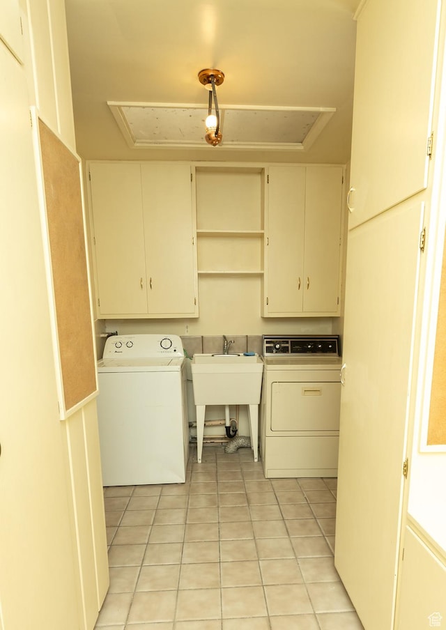 215 N 300 W, Salina, UT 84654 - washroom with cabinet space, attic access, and light tile patterned flooring