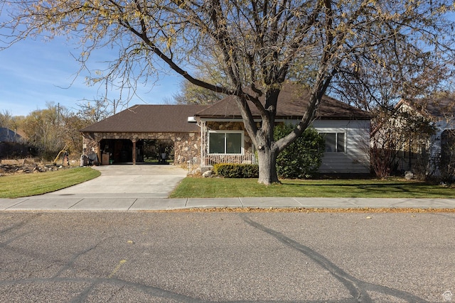 215 N 300 W, Salina, UT 84654 - view of front of property featuring concrete driveway, stone siding, and a front yard