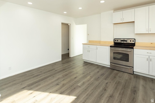 215 N 300 W, Salina, UT 84654 - kitchen featuring stainless steel electric range, wooden counters, recessed lighting, wood finished floors, and white cabinets