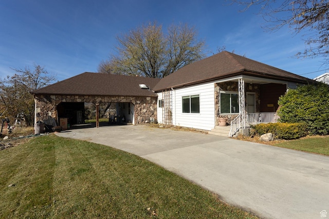 215 N 300 W, Salina, UT 84654 - view of front facade with driveway, stone siding, covered porch, and a front yard