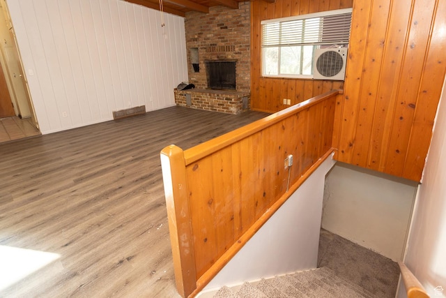215 N 300 W, Salina, UT 84654 - stairway with wood finished floors, wooden walls, a brick fireplace, and beam ceiling