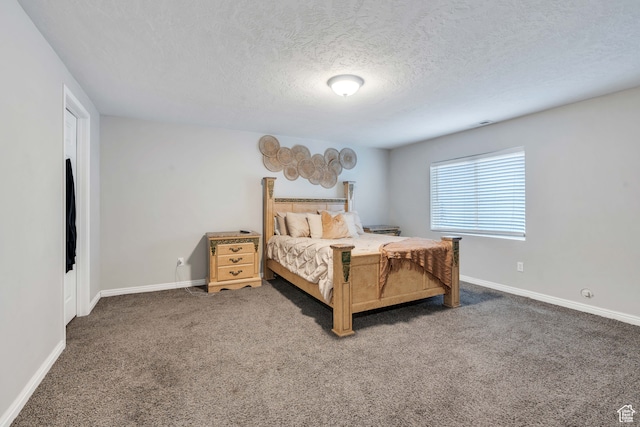 carpeted bedroom with a textured ceiling