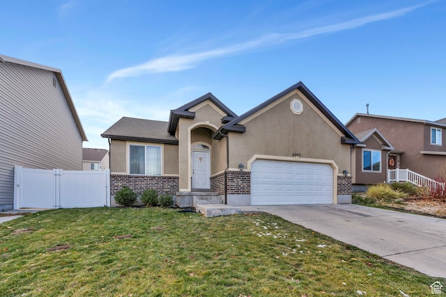 view of front of home featuring a garage and a front lawn