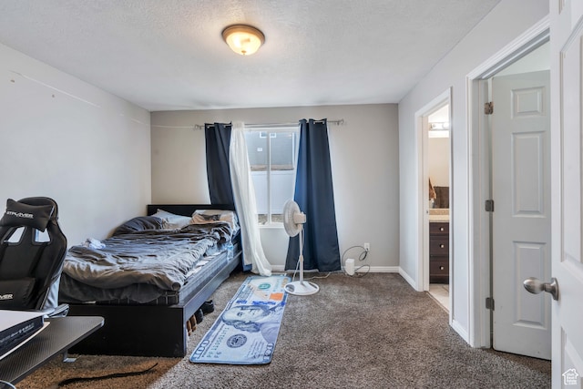 bedroom featuring carpet floors, a textured ceiling, and connected bathroom