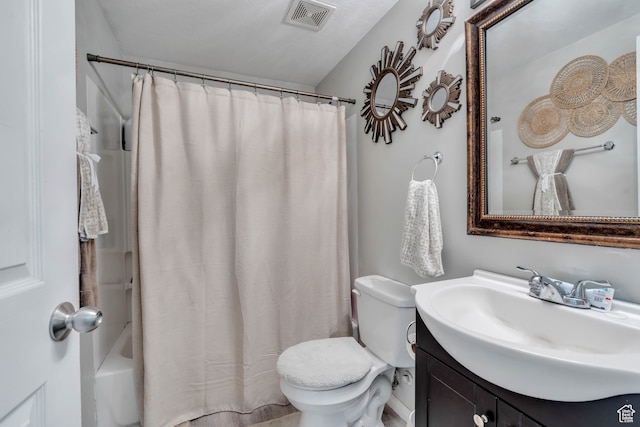 full bathroom with vanity, shower / bath combination with curtain, and toilet