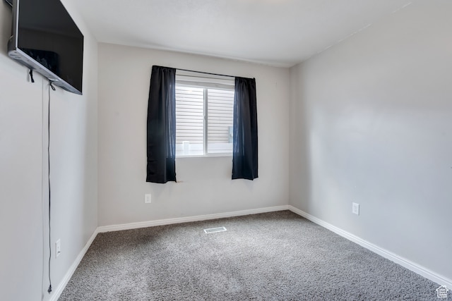 empty room featuring carpet flooring