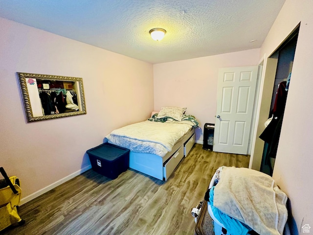 6301 S 2700 W, Taylorsville, UT 84129 - bedroom featuring wood finished floors, baseboards, and a textured ceiling