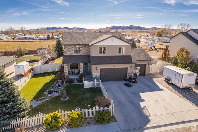 1605 W 1400 S, Vernal, UT 84078 - view of front property with a mountain view, a garage, and a front yard
