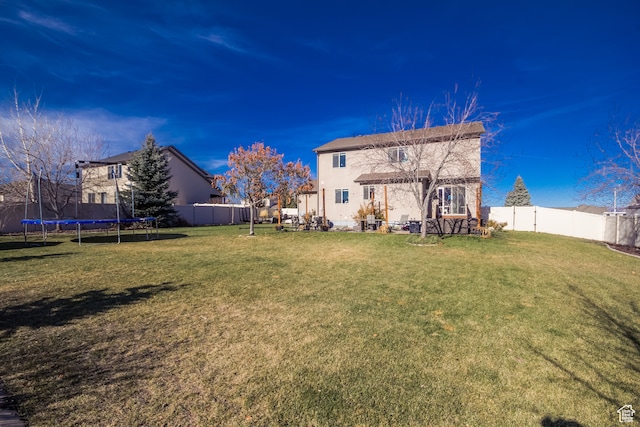 1605 W 1400 S, Vernal, UT 84078 - rear view of house featuring a trampoline and a yard