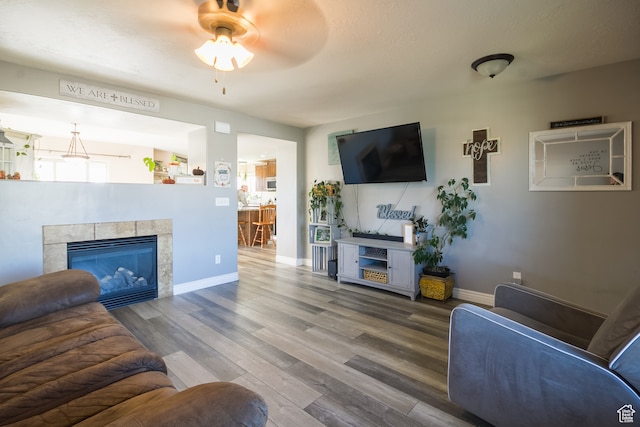 1605 W 1400 S, Vernal, UT 84078 - living room featuring hardwood / wood-style flooring, ceiling fan, and a tiled fireplace