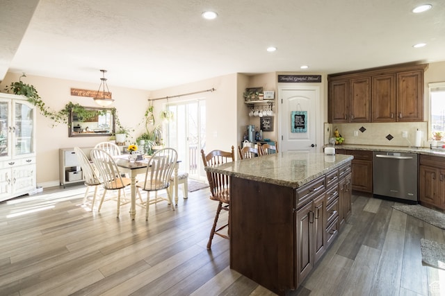 1605 W 1400 S, Vernal, UT 84078 - kitchen featuring plenty of natural light, stainless steel dishwasher, decorative light fixtures, and hardwood / wood-style flooring