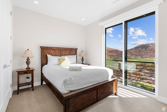 carpeted bedroom featuring a mountain view