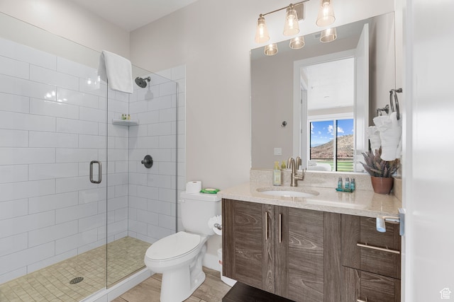 bathroom with walk in shower, tile patterned flooring, vanity, and toilet