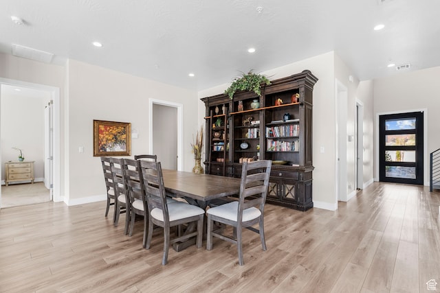 dining space featuring light hardwood / wood-style flooring