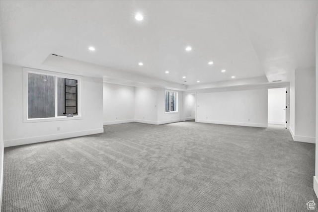 unfurnished living room featuring carpet