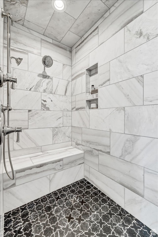 bathroom featuring tiled shower