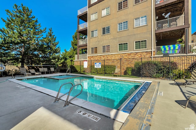 5012 S Timber Way E Unit 205, Holladay, UT 84117 - view of pool featuring a hot tub and a patio
