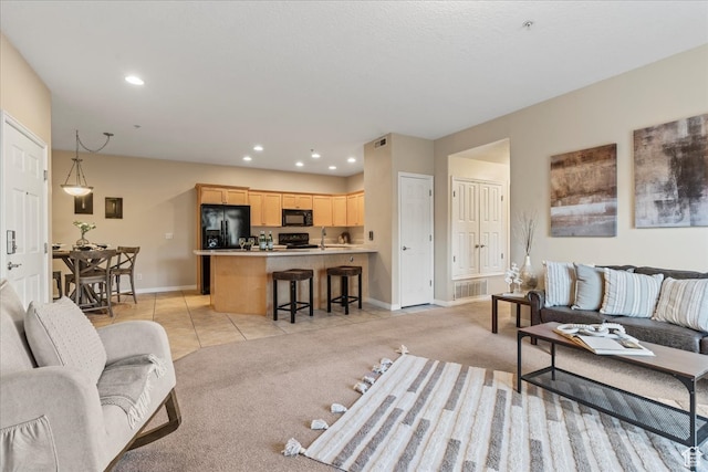 carpeted living room featuring sink