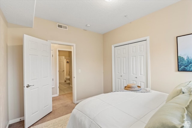 5012 S Timber Way E Unit 205, Holladay, UT 84117 - carpeted bedroom with a closet and a textured ceiling