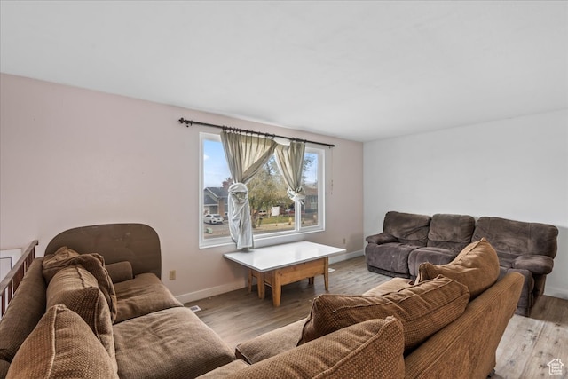 living room with light hardwood / wood-style floors