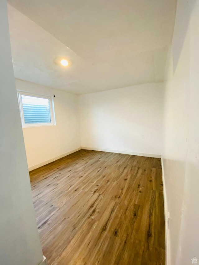 unfurnished room featuring wood-type flooring