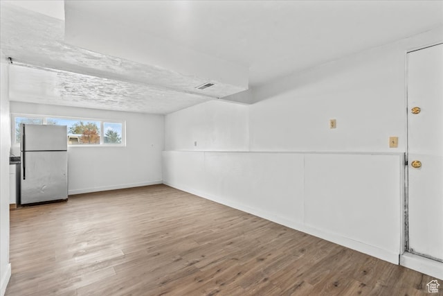 spare room featuring hardwood / wood-style floors