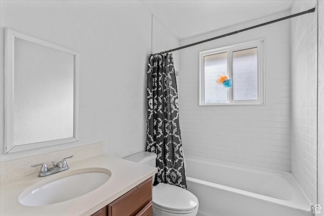 full bathroom featuring vanity, toilet, and shower / tub combo