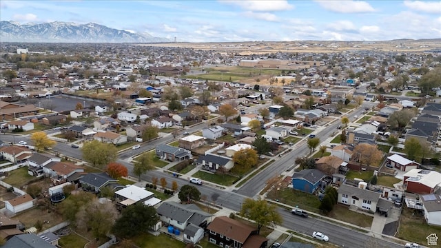 birds eye view of property with a mountain view