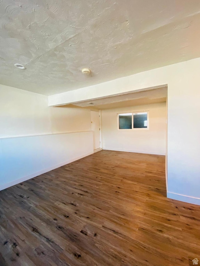 unfurnished room featuring dark hardwood / wood-style flooring